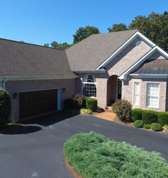 Asphalt driveway in front of home